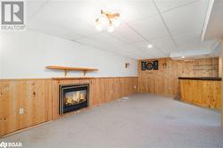 Basement with carpet floors and a drop ceiling - 