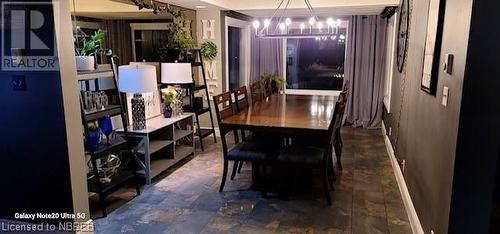 Dining space featuring an inviting chandelier - 112 Holditch Street, Sturgeon Falls, ON - Indoor Photo Showing Dining Room