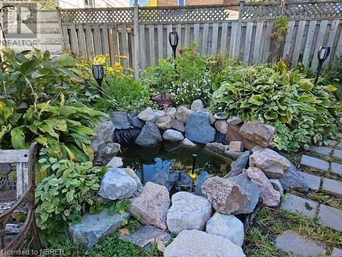 View of yard with a small pond - 112 Holditch Street, Sturgeon Falls, ON - Outdoor