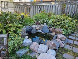 View of yard with a small pond - 