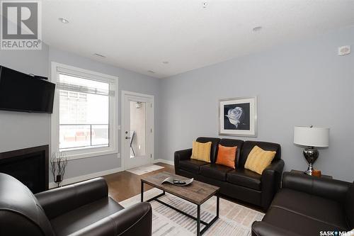 1006 2055 Rose Street, Regina, SK - Indoor Photo Showing Living Room With Fireplace