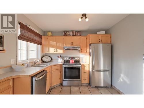 3145 Wilson Street Unit# 102, Penticton, BC - Indoor Photo Showing Kitchen With Double Sink