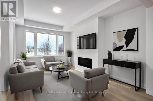 5 - 11 Bay Street, Blue Mountains (Thornbury), ON - Indoor Photo Showing Living Room With Fireplace