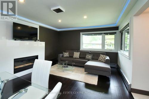 3836 Brookside Drive, West Lincoln, ON - Indoor Photo Showing Living Room With Fireplace