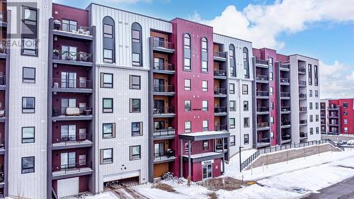 614 - 4 Spice Way, Barrie, ON - Outdoor With Balcony With Facade