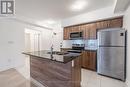 614 - 4 Spice Way, Barrie, ON  - Indoor Photo Showing Kitchen With Double Sink With Upgraded Kitchen 