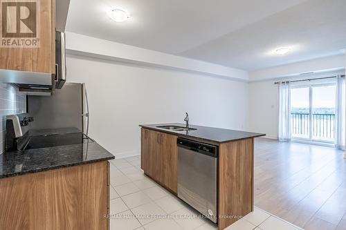 614 - 4 Spice Way, Barrie, ON - Indoor Photo Showing Kitchen With Double Sink