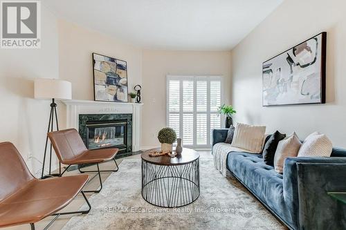 34 - 20 Kitty Murray Lane, Hamilton (Meadowlands), ON - Indoor Photo Showing Living Room With Fireplace