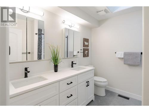 New vanity with dual under mount sinks and quartz countertop - 2365 Stillingfleet Road Unit# 360, Kelowna, BC - Indoor Photo Showing Bathroom