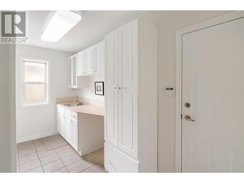 Walk-in laundry room with a sink and ample storage options - 2365 Stillingfleet Road Unit# 360, Kelowna, BC - Indoor