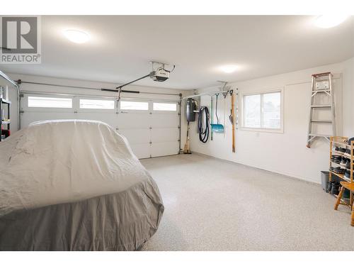 Spacious and immaculate garage which was re-painted - 2365 Stillingfleet Road Unit# 360, Kelowna, BC - Indoor Photo Showing Garage