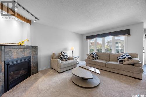 5054 Wascana Vista Court, Regina, SK - Indoor Photo Showing Living Room With Fireplace