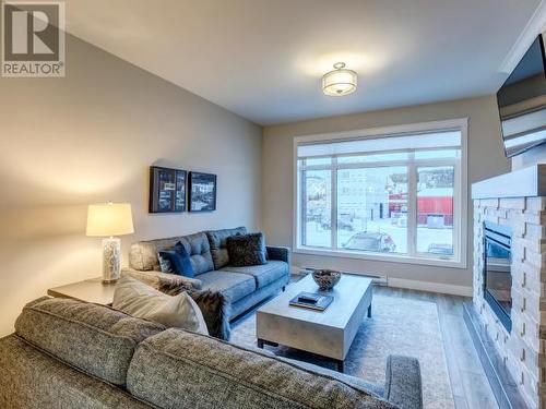 105-38 Waterfront Place, Whitehorse, YT - Indoor Photo Showing Living Room With Fireplace