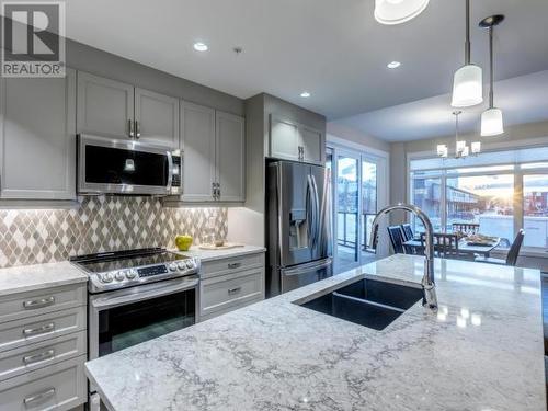 105-38 Waterfront Place, Whitehorse, YT - Indoor Photo Showing Kitchen With Double Sink With Upgraded Kitchen