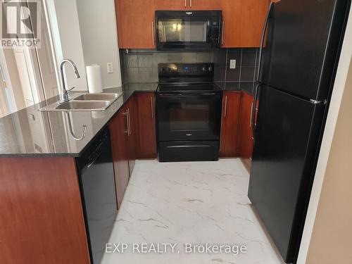 1613 - 310 Burnhamthorpe Road W, Mississauga, ON - Indoor Photo Showing Kitchen With Double Sink