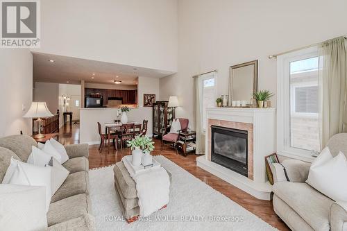 5A - 350 Doon Valley Drive, Kitchener, ON - Indoor Photo Showing Living Room With Fireplace