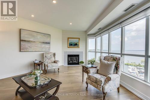 1011 - 2 Toronto Street S, Barrie, ON - Indoor Photo Showing Living Room With Fireplace