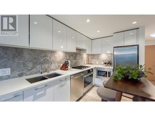 603 8538 River District Crossing, Vancouver, BC - Indoor Photo Showing Kitchen With Stainless Steel Kitchen With Double Sink With Upgraded Kitchen