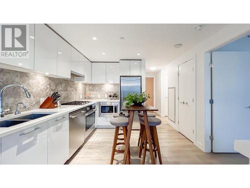 603 8538 River District Crossing, Vancouver, BC - Indoor Photo Showing Kitchen With Stainless Steel Kitchen With Double Sink With Upgraded Kitchen