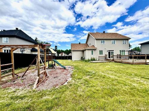 Back facade - 33 Rue Des Cerisiers, Vaudreuil-Dorion, QC - Outdoor With Deck Patio Veranda With Backyard