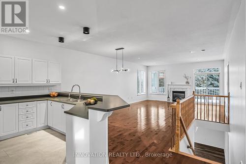 7 Eileen Crescent, Ottawa, ON - Indoor Photo Showing Kitchen With Fireplace