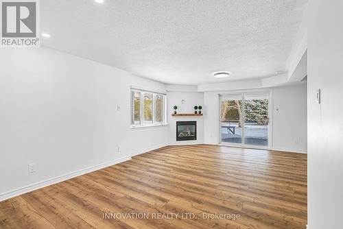 7 Eileen Crescent, Ottawa, ON - Indoor Photo Showing Living Room With Fireplace