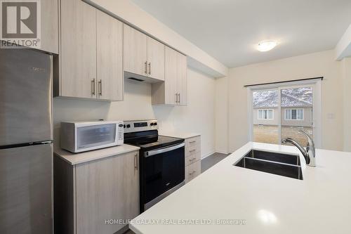 67 Oakmont Drive, Loyalist, ON - Indoor Photo Showing Kitchen With Stainless Steel Kitchen With Double Sink