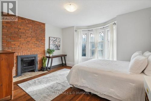 220 Fern Avenue, Toronto, ON - Indoor Photo Showing Bedroom With Fireplace