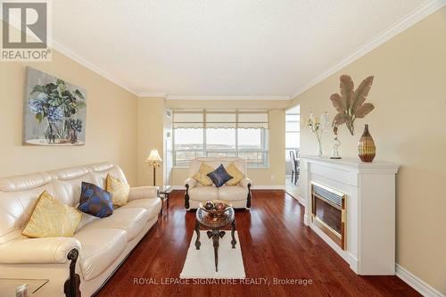 1705 - 35 Kingsbridge Garden Circle, Mississauga, ON - Indoor Photo Showing Living Room With Fireplace