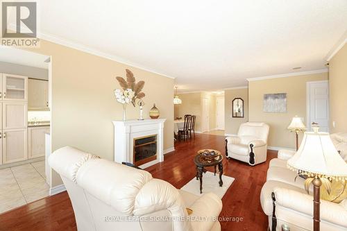 1705 - 35 Kingsbridge Garden Circle, Mississauga, ON - Indoor Photo Showing Living Room With Fireplace