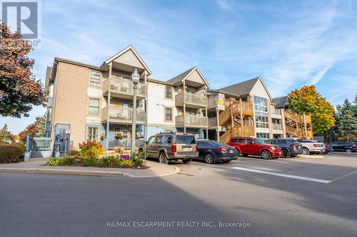 109 - 2010 Cleaver Avenue, Burlington, ON - Outdoor With Balcony With Facade