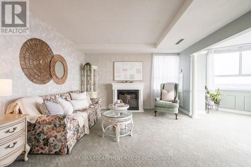 911 - 5280 Lakeshore Road, Burlington, ON - Indoor Photo Showing Living Room With Fireplace