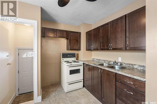 134 G Avenue N, Saskatoon, SK - Indoor Photo Showing Kitchen With Double Sink