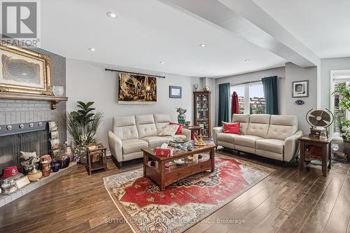 7144 Danton Promenade, Mississauga, ON - Indoor Photo Showing Living Room With Fireplace