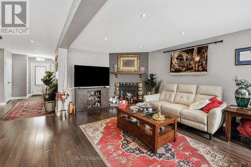 7144 Danton Promenade, Mississauga, ON - Indoor Photo Showing Living Room With Fireplace