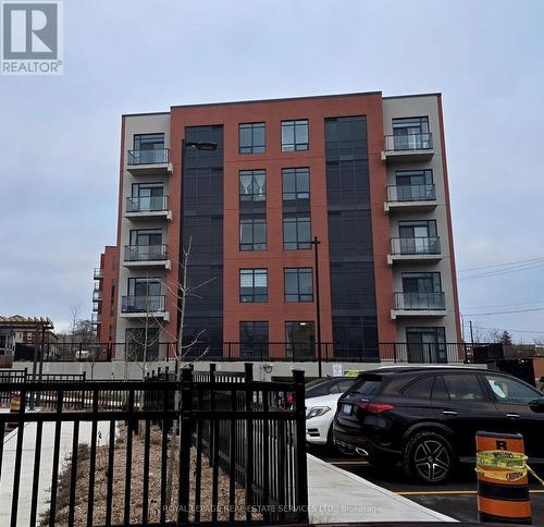 518 - 1010 Dundas Street E, Whitby, ON - Outdoor With Balcony With Facade