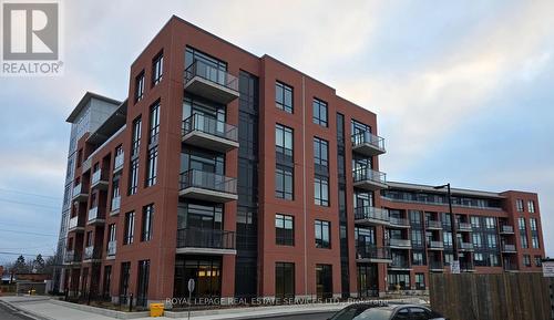 518 - 1010 Dundas Street E, Whitby, ON - Outdoor With Balcony With Facade