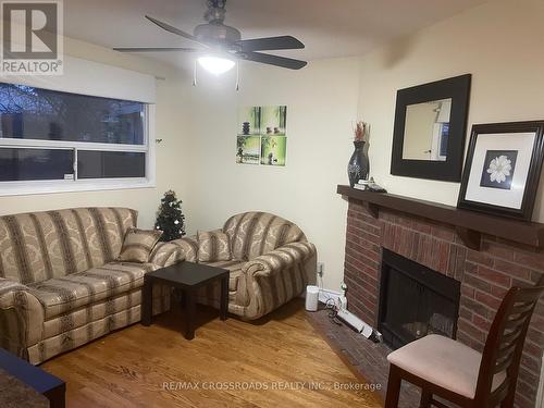 32 Briarwood Avenue, Toronto, ON - Indoor Photo Showing Living Room With Fireplace