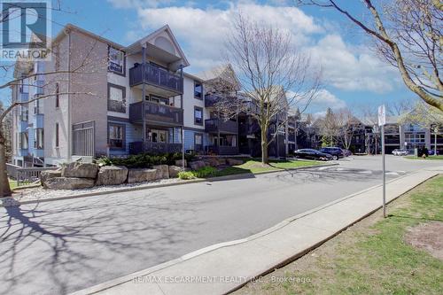 213 - 2030 Cleaver Avenue, Burlington, ON - Outdoor With Balcony With Facade