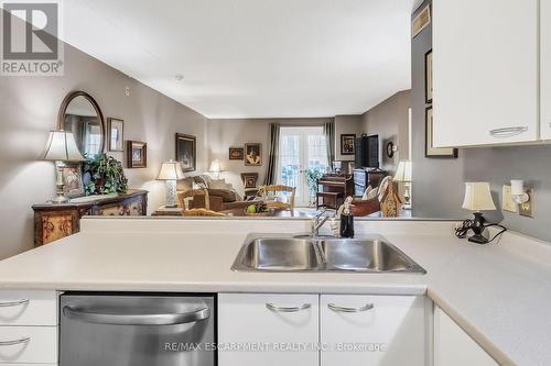 213 - 2030 Cleaver Avenue, Burlington, ON - Indoor Photo Showing Kitchen With Double Sink