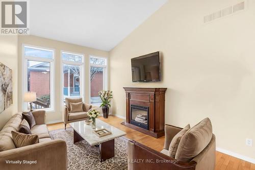 25 Briardale Crescent N, Ottawa, ON - Indoor Photo Showing Living Room With Fireplace