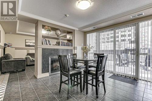 108 - 1030 Coronation Drive N, London, ON - Indoor Photo Showing Dining Room With Fireplace