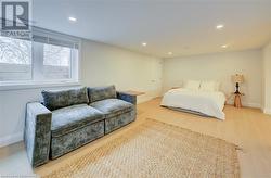 Bedroom with light hardwood / wood-style floors - 