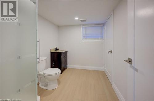 Bathroom featuring vanity, toilet, and wood-type flooring - 209 Cornwall Street, Waterloo, ON - Indoor