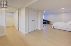 Bedroom with a closet and light hardwood / wood-style floors - 