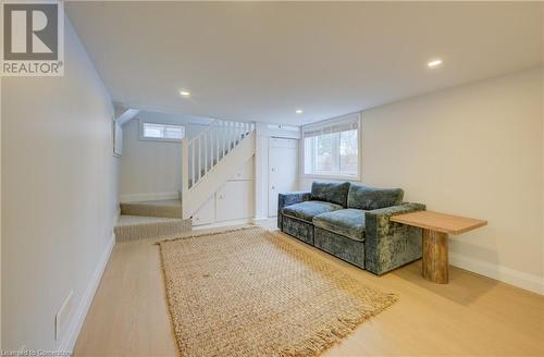 Living room featuring hardwood / wood-style flooring and a healthy amount of sunlight - 209 Cornwall Street, Waterloo, ON - Indoor