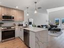 205-7098 Wallace Dr, Central Saanich, BC  - Indoor Photo Showing Kitchen With Double Sink With Upgraded Kitchen 