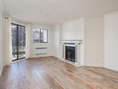 212-1560 Hillside Ave, Victoria, BC - Indoor Photo Showing Living Room With Fireplace