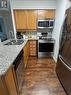 1717 - 335 Rathburn Road W, Mississauga, ON  - Indoor Photo Showing Kitchen With Double Sink 