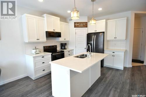 357 Germain Manor, Saskatoon, SK - Indoor Photo Showing Kitchen With Double Sink